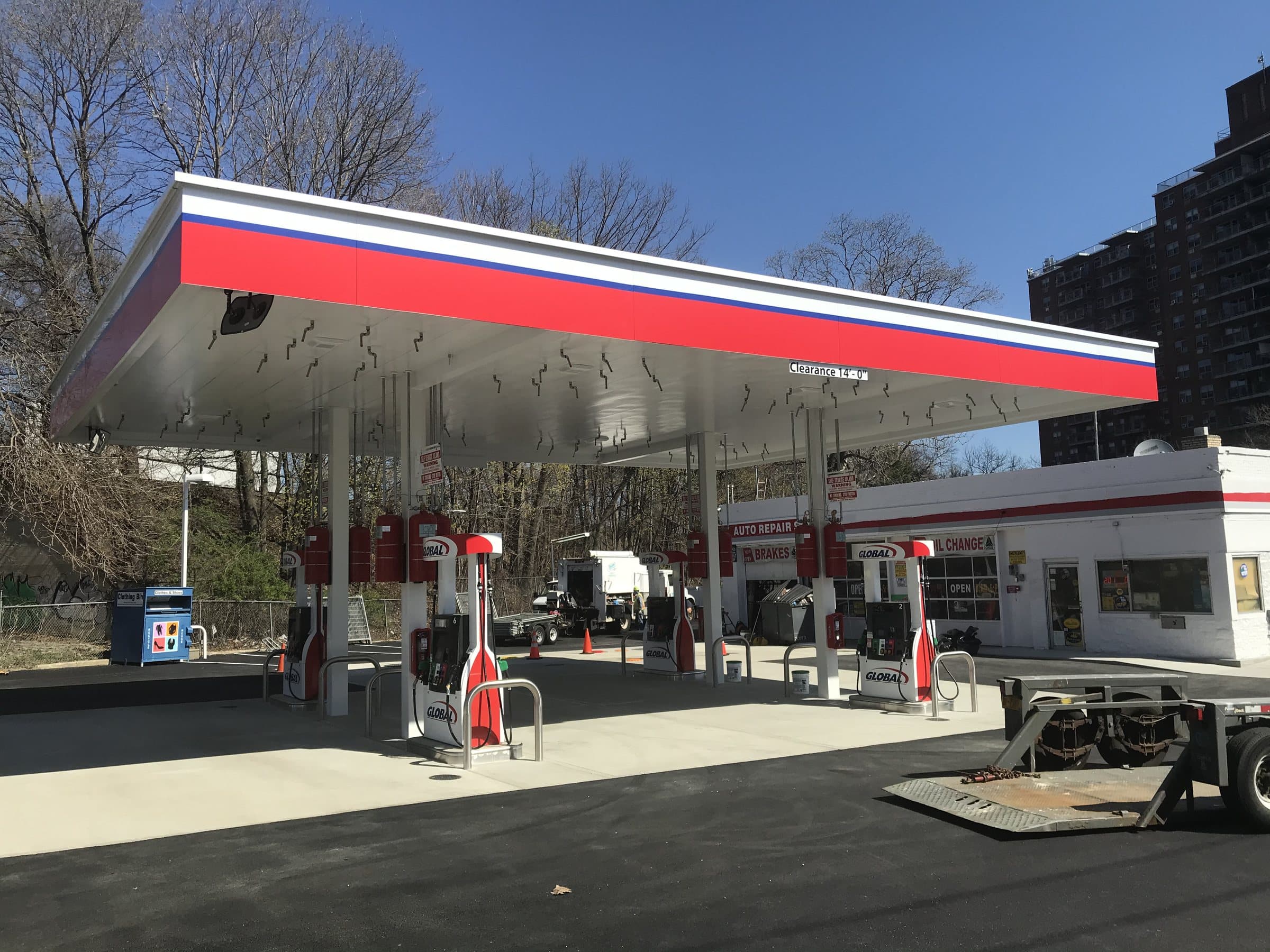 Retail fuel dispensers beneath a service-station canopy.